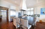 Kitchen island with stainless steel appliances in view